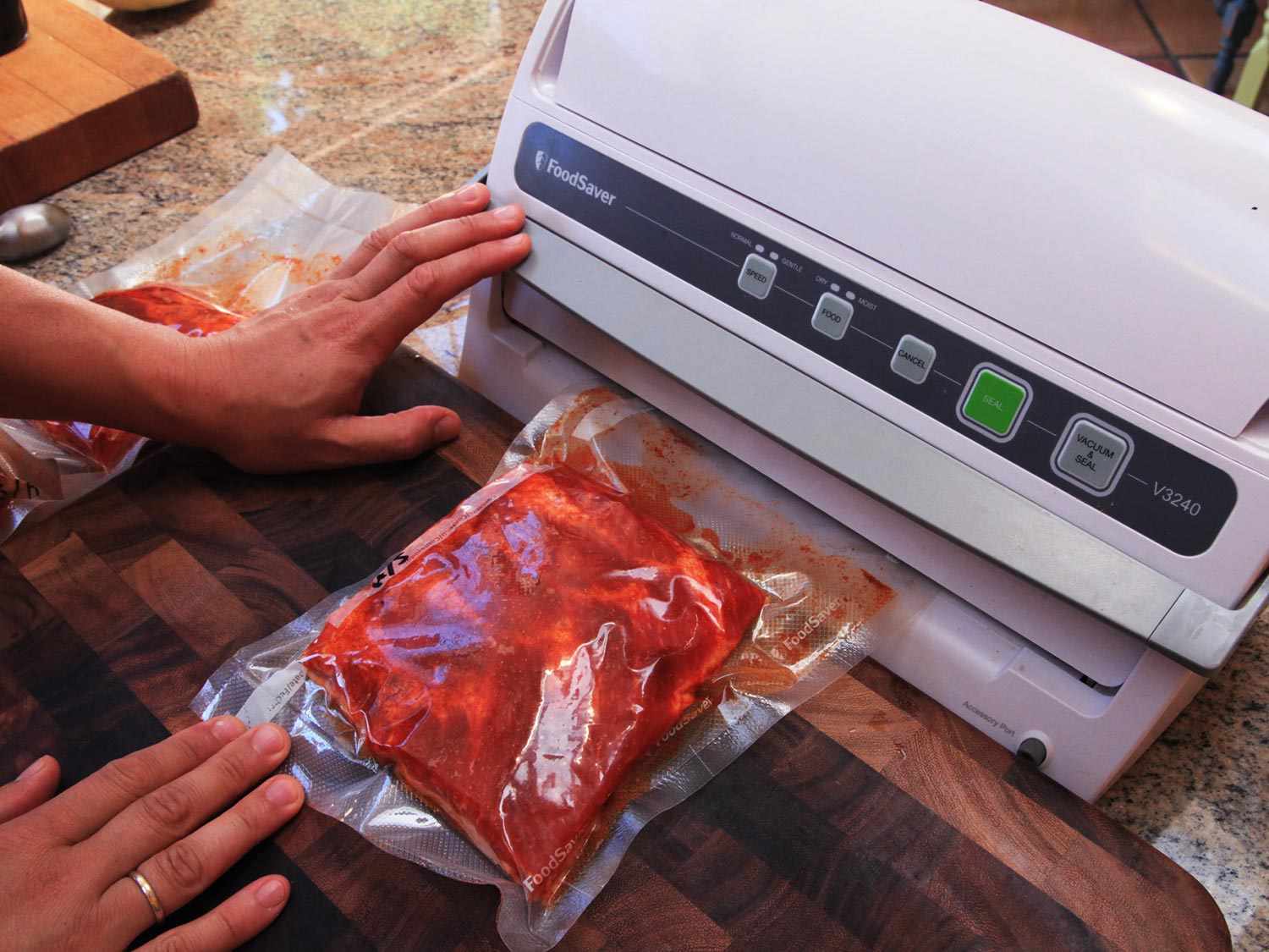 Vacuum-sealing pork ribs before cooking sous vide