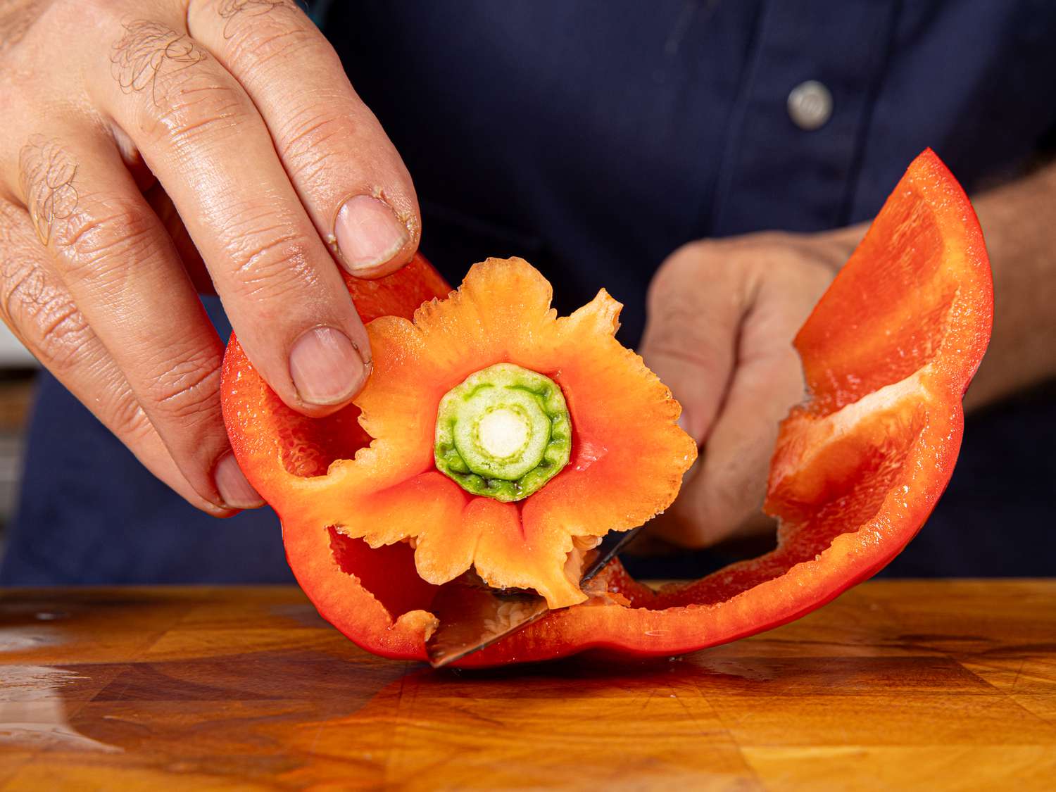 Side view of cutting the walls off a bell pepper