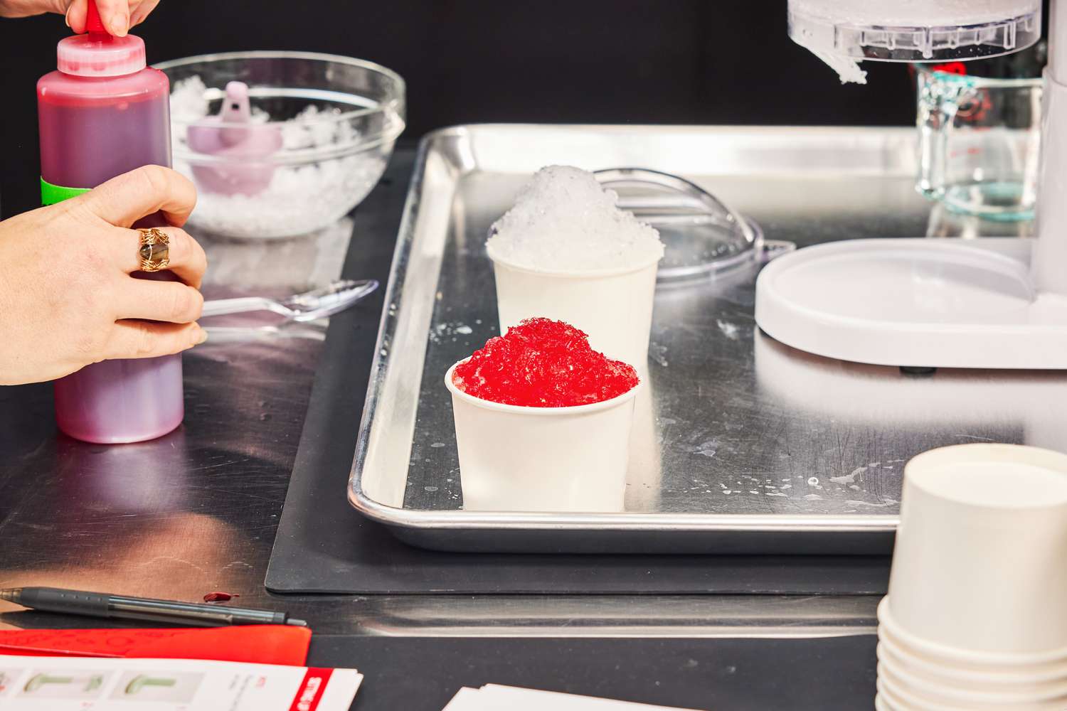 two cups of shaved on a sheet tray