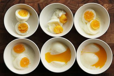 Overhead comparison shot of eggs cooked sous vide at different temperatures