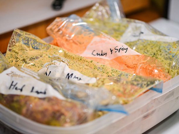 Labeled bags of meat and marinade.