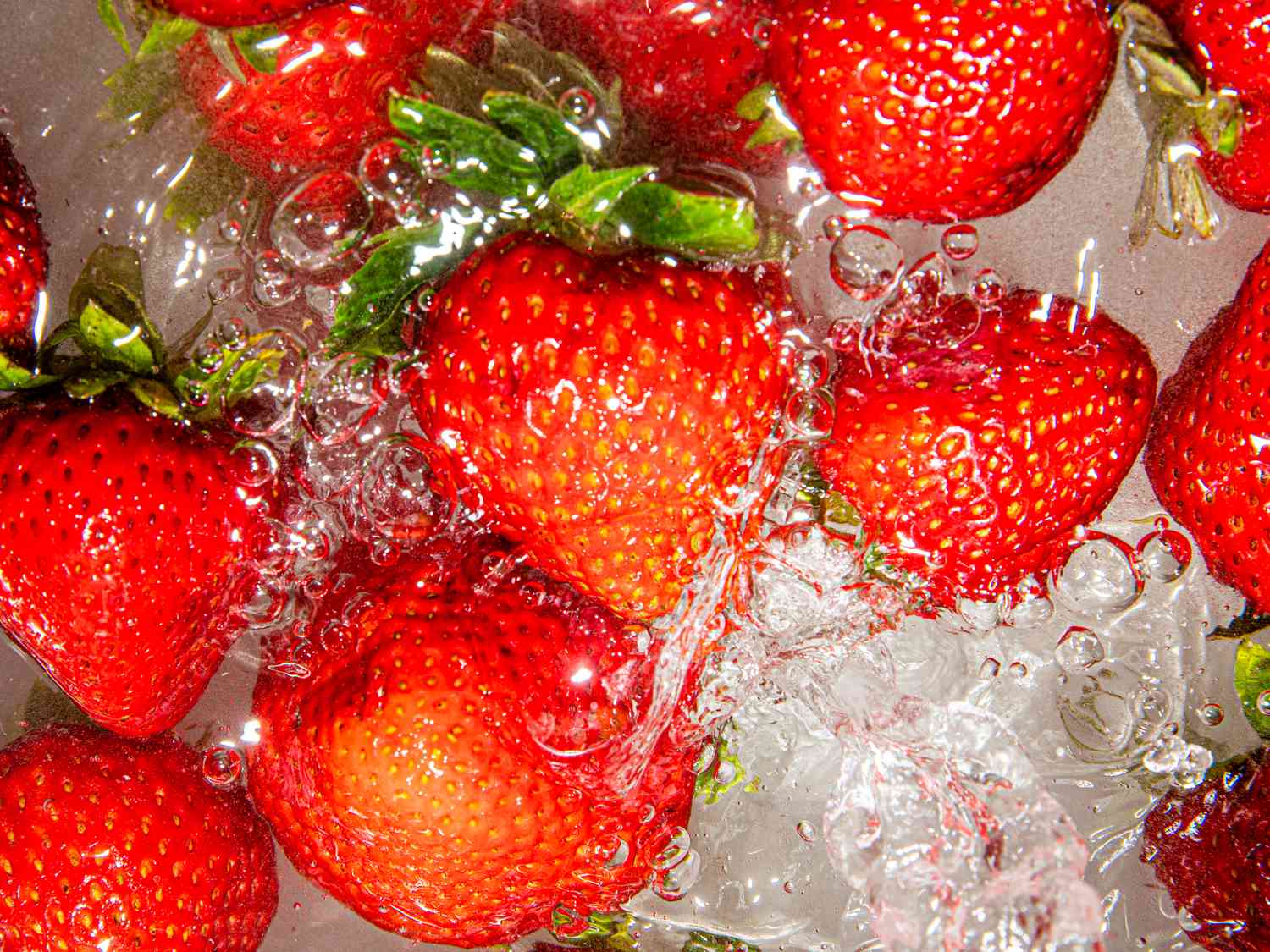 Overhead view of washing strawberries