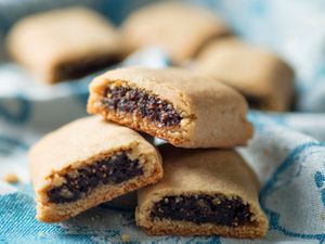 Homemade Fig Newtons on a kitchen towel