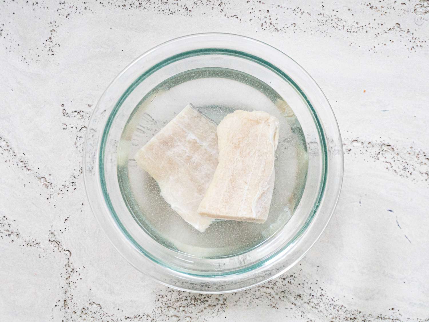 Sliced cod in a glass bowl.