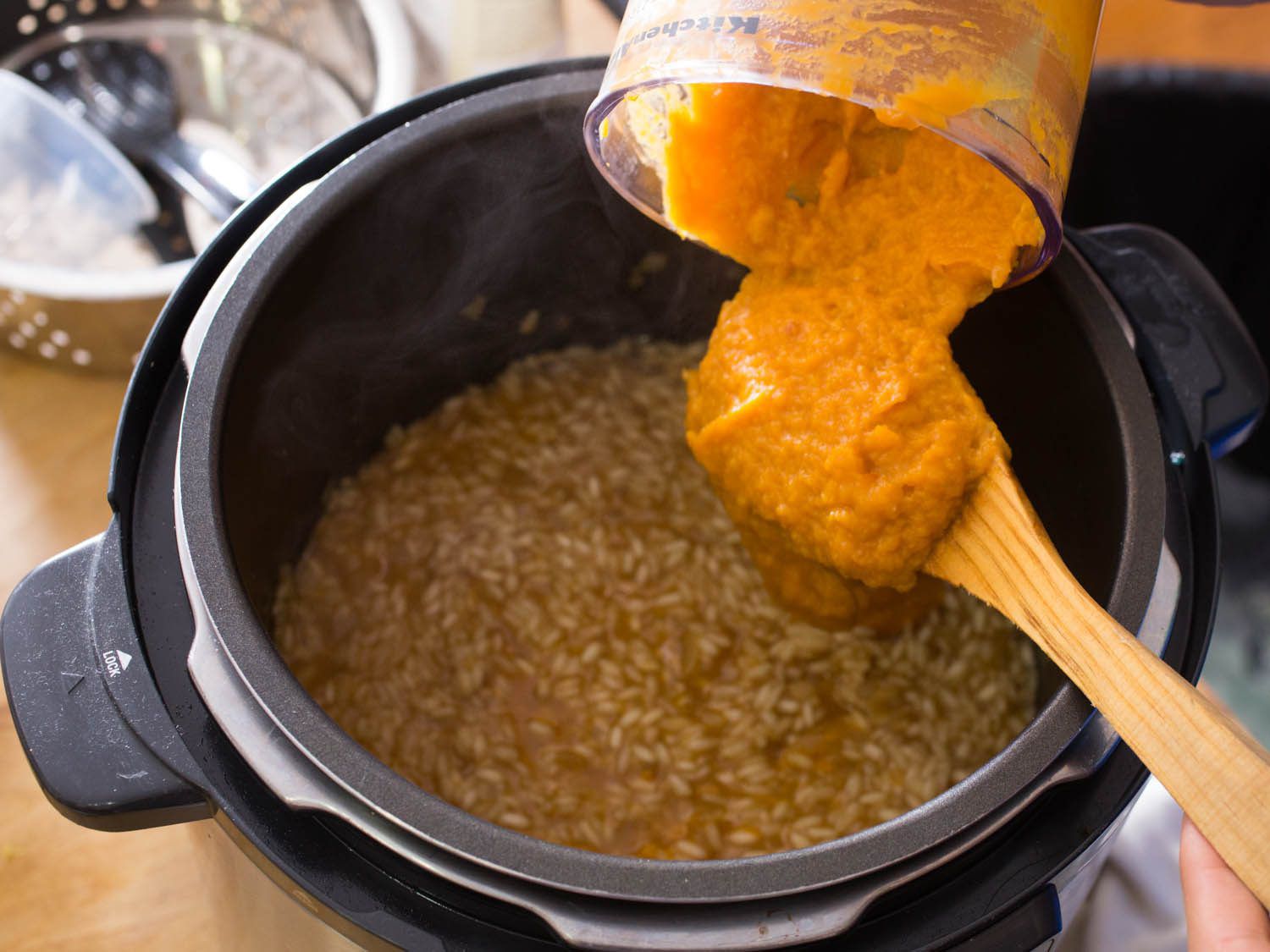 incorporating butternut squash purée into cooked risotto rice