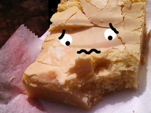 Square of Philadelphia butter cake with cartoon face