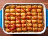 overhead view of tater tot hot dish drizzled with ketchup