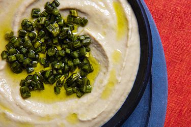 Overhead, close up view of garlic scape hummus