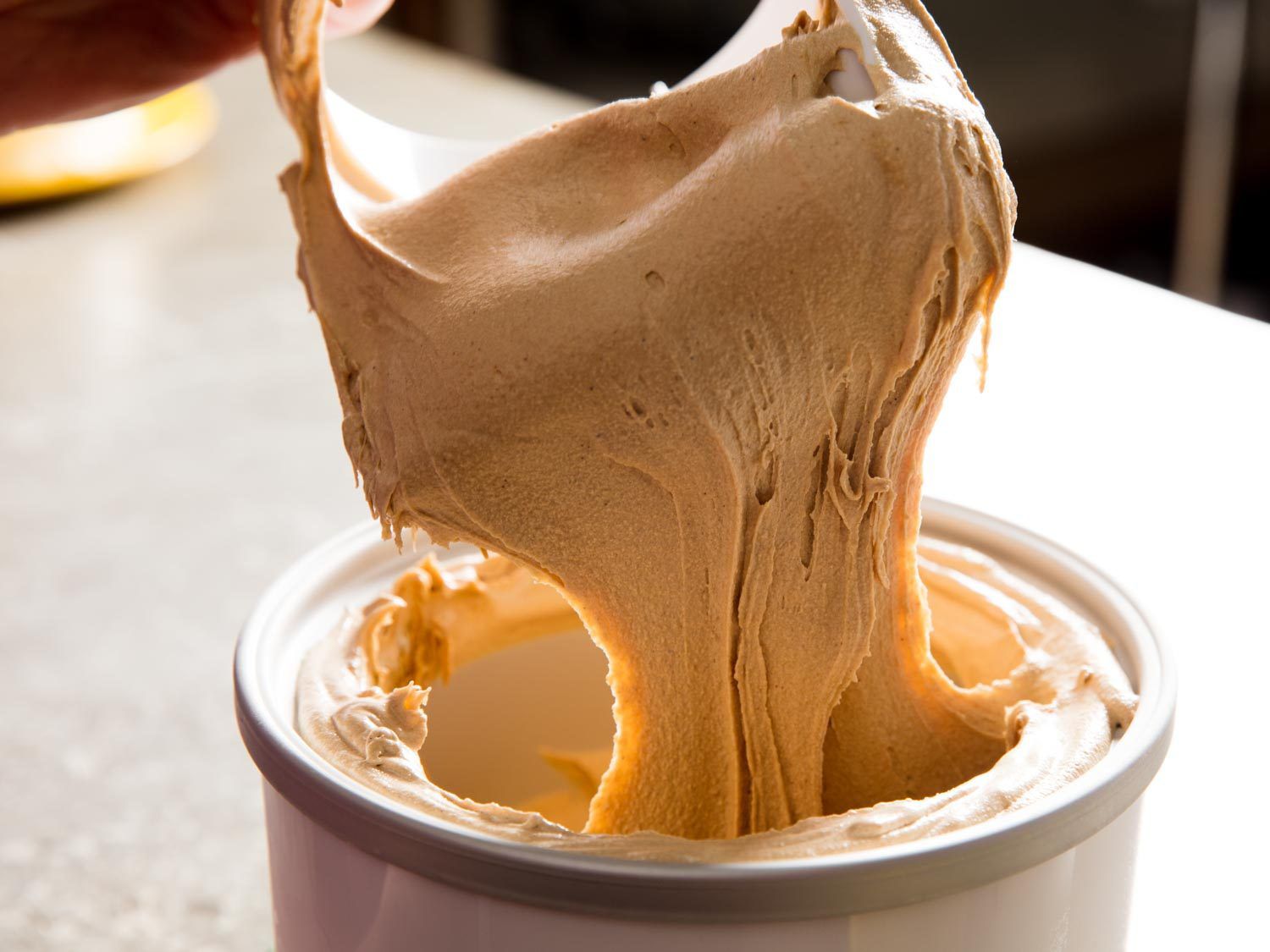 Pulling an ice cream making-paddle from the machine.