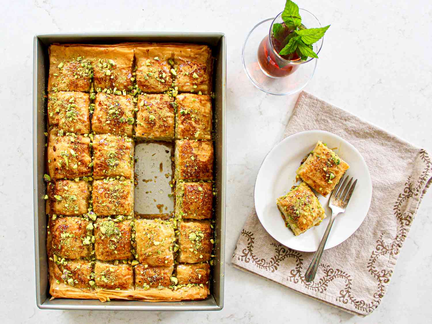 Table scene with baklava and mint tea