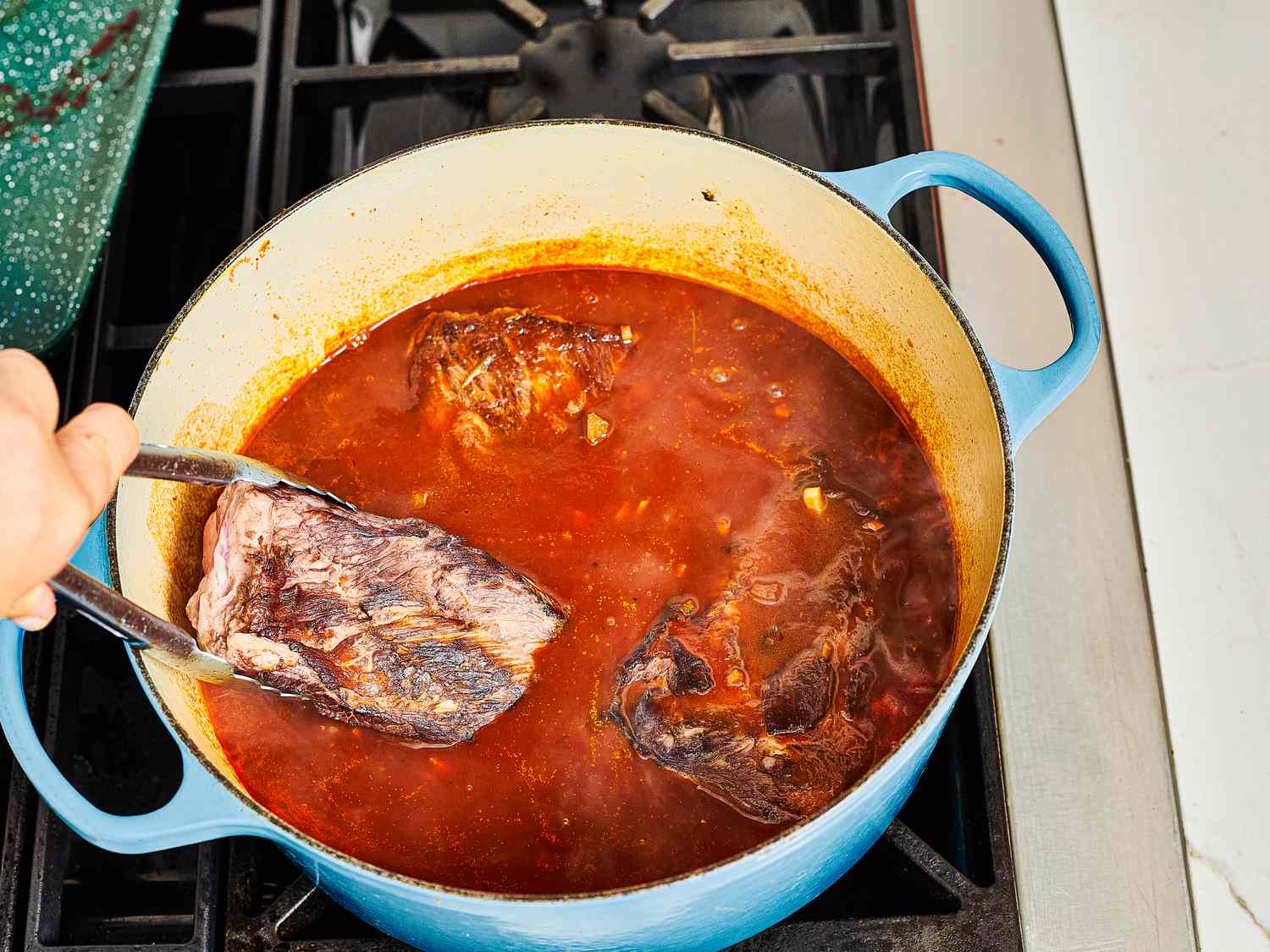 Overhead view of adding ribs to dutch oven