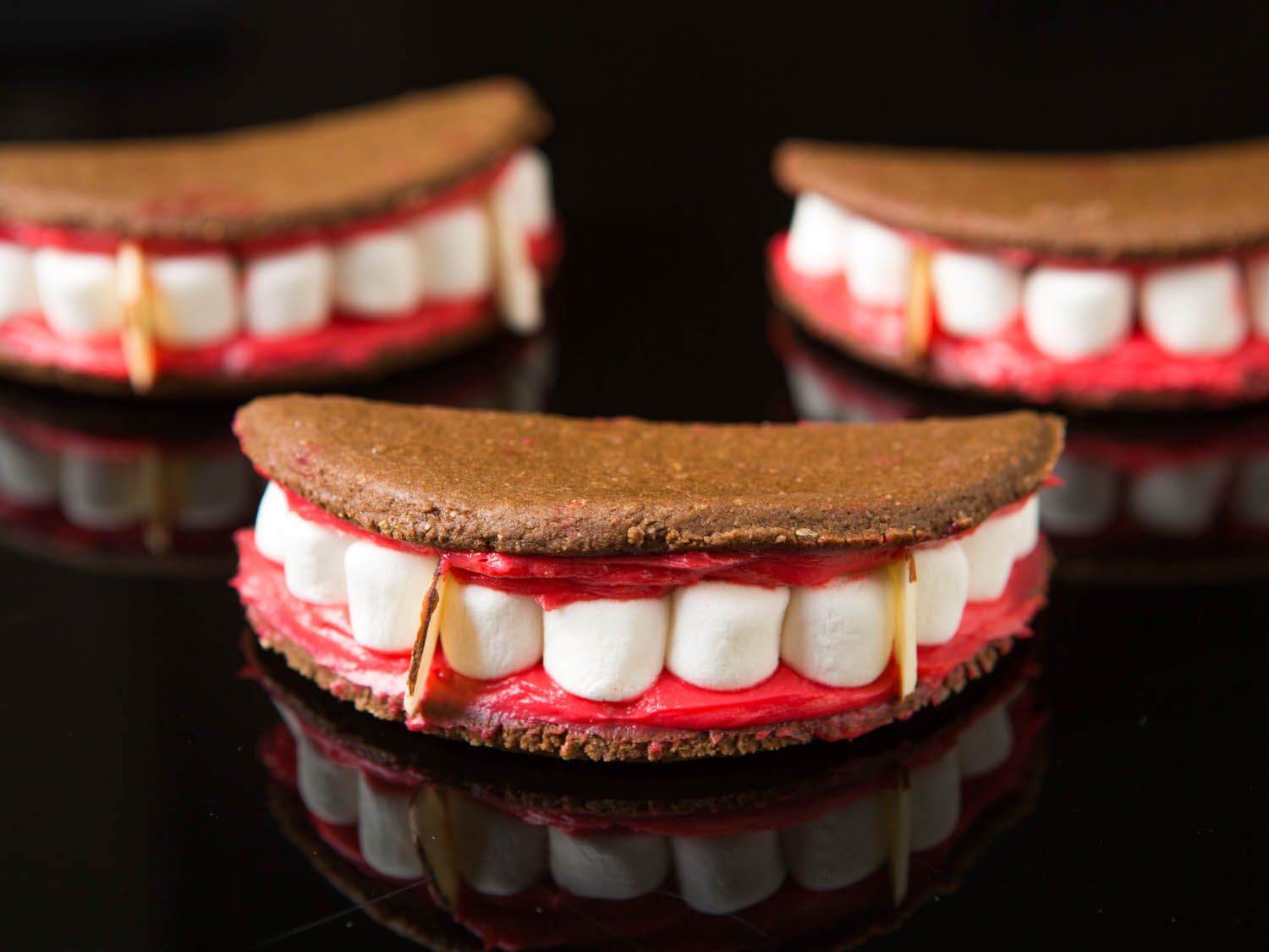 Three vampire mouth sandwich cookies