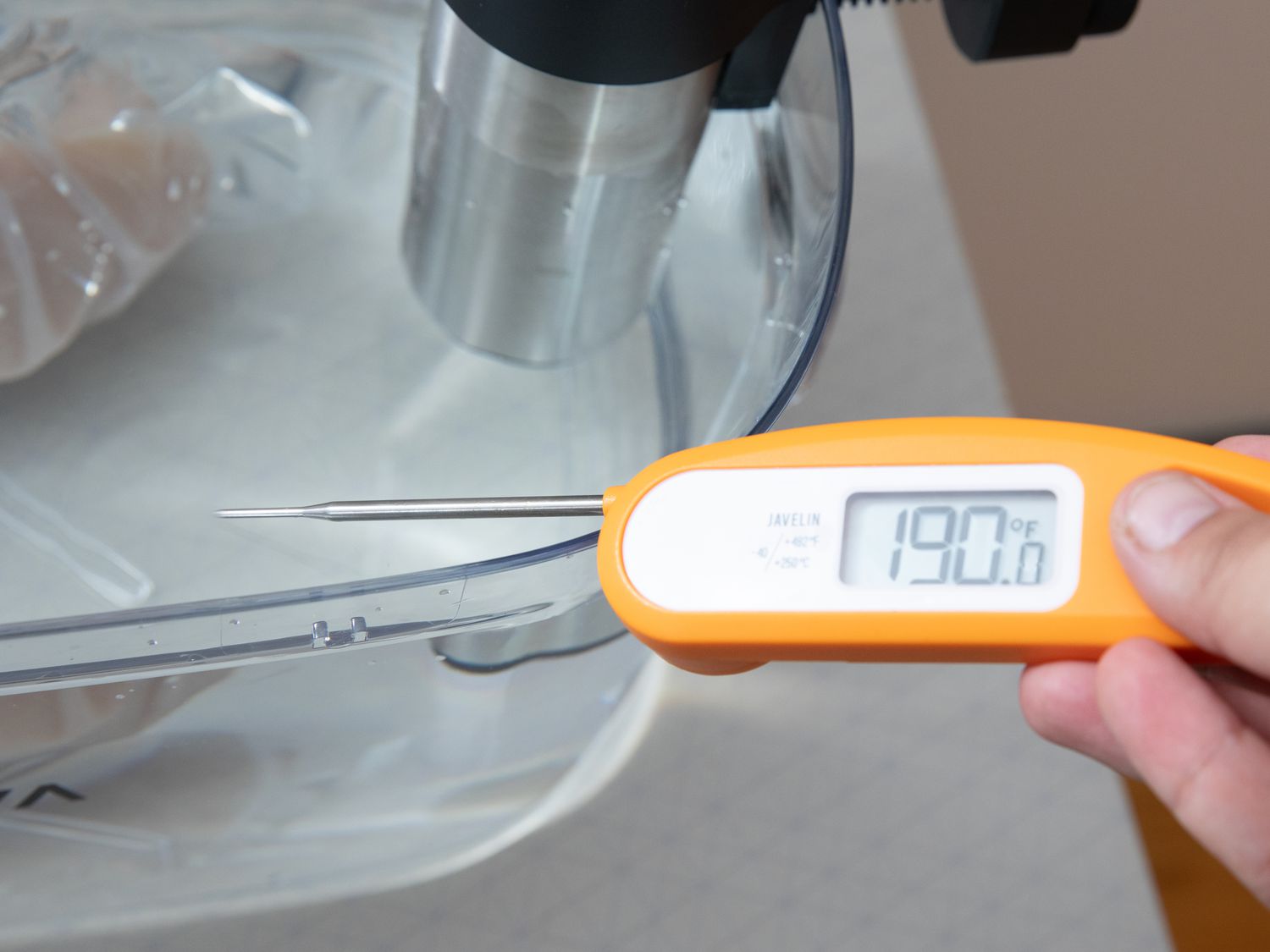 taking the temperature of the water bath of the sous vide