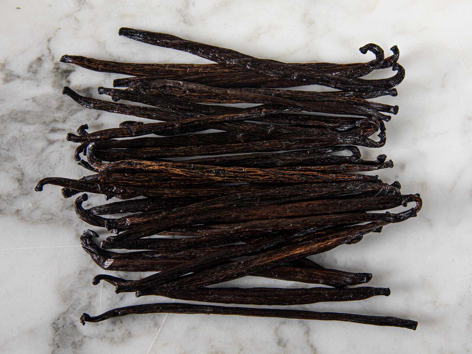 Vanilla beans on a granite countertop