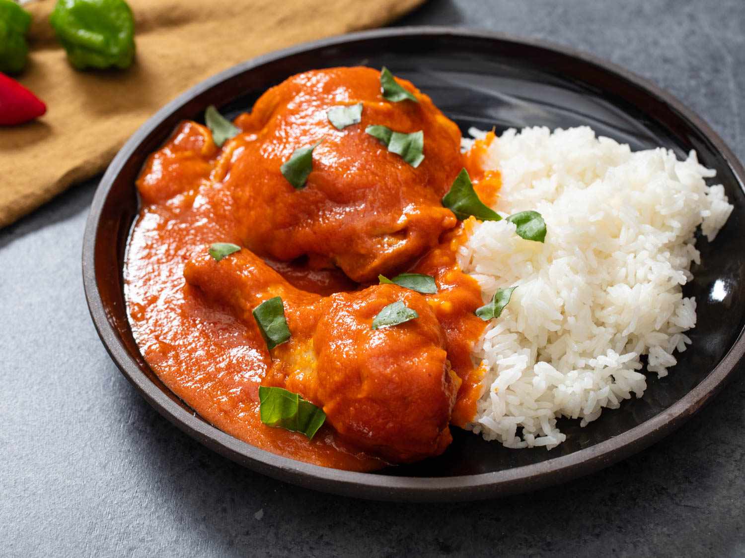 A plate of rice served with chicken simmered in obe ata.