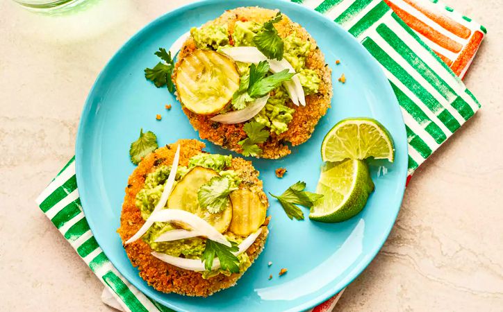 Overhead view of chickpeas with mashed avocados