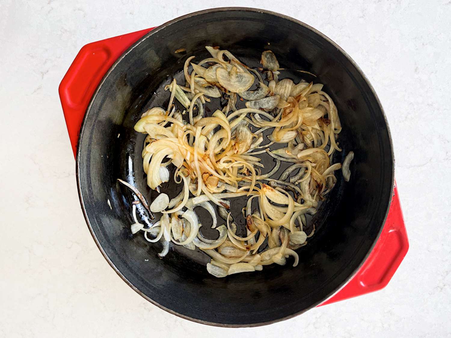 Golden onions in a dutch oven