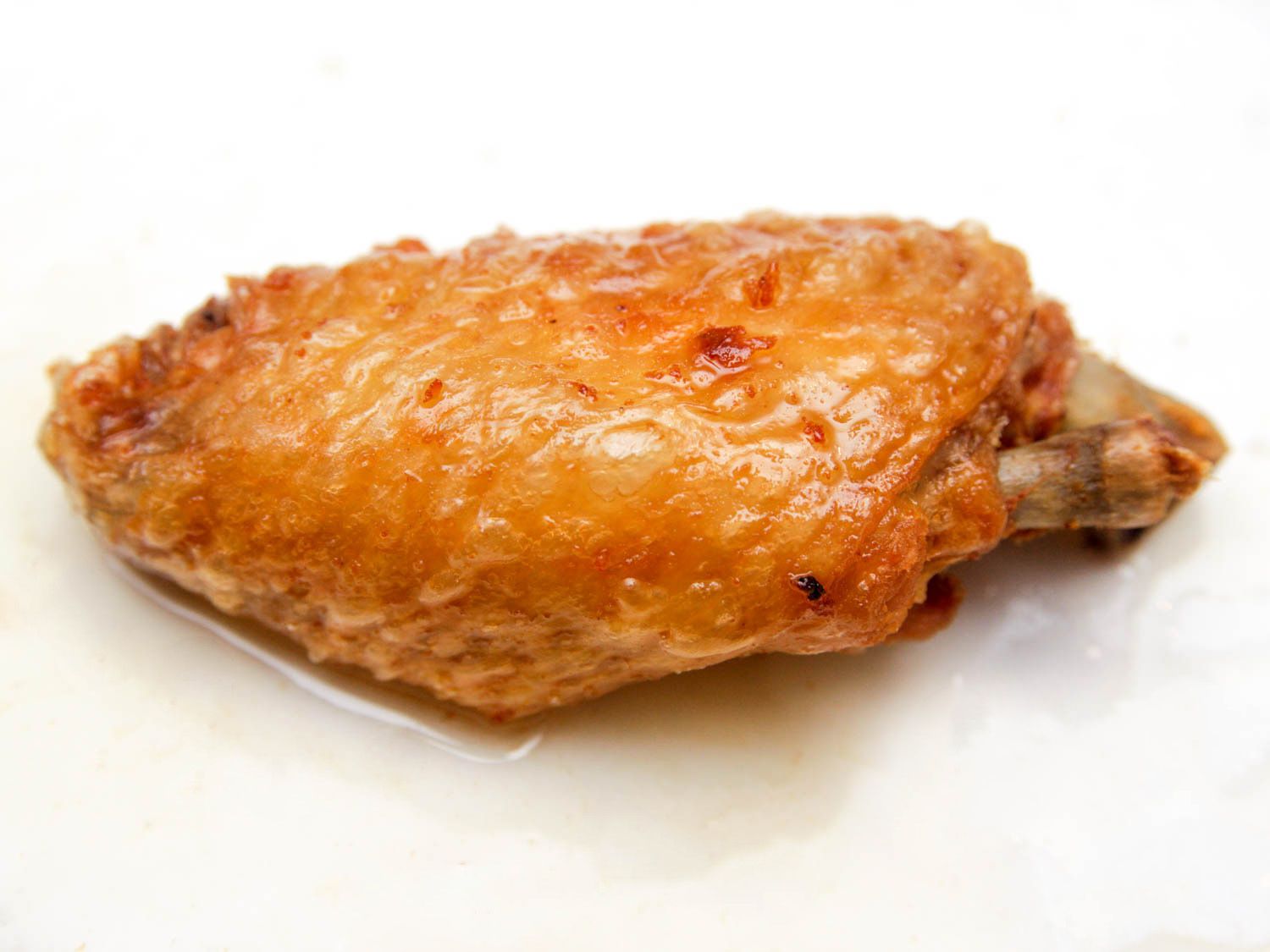 Blistered and bubbled skin on fried chicken wing flat