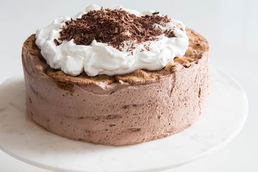 Mocha Icebox Cake topped with whipped cream and chocolate shavings